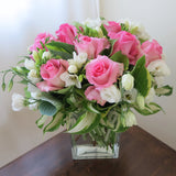 Flowers used: pink roses, white freesias, white lisianthus, hosta leaves