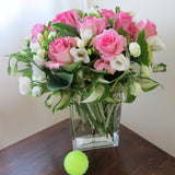 Flowers used: pink roses, white freesias, white lisianthus, hosta leaves