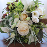 Flowers used: white roses, white calla lilies, white lisianthus, chartreuse lady's mantle