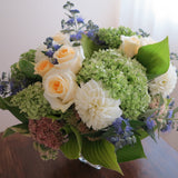 Flowers used: green hydrangeas, cream roses, white dahlias, blue spirea, pink sedums, hosta leaves