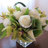 Flowers used: white roses, chartreuse cymbidium orchids, hosta leaves