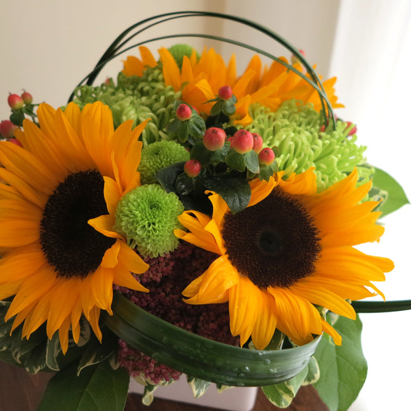 Flowers used: yellow sunflowers, green mums, pink hypericum, pink sedums