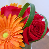 Flowers used: red roses, orange gerberas