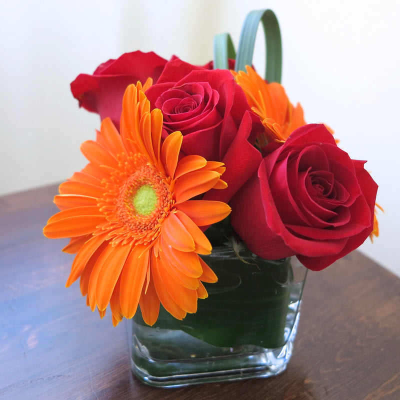 Flowers used: red roses, orange gerberas