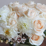 Flowers used: cream roses, white orchids and dahlias adored by white hypericum and dogwoods berries