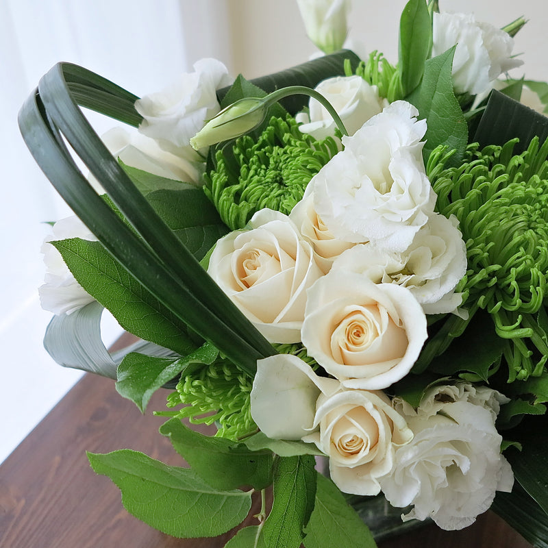 Flowers used: cream roses, white lisianthus, green chrysanthemums