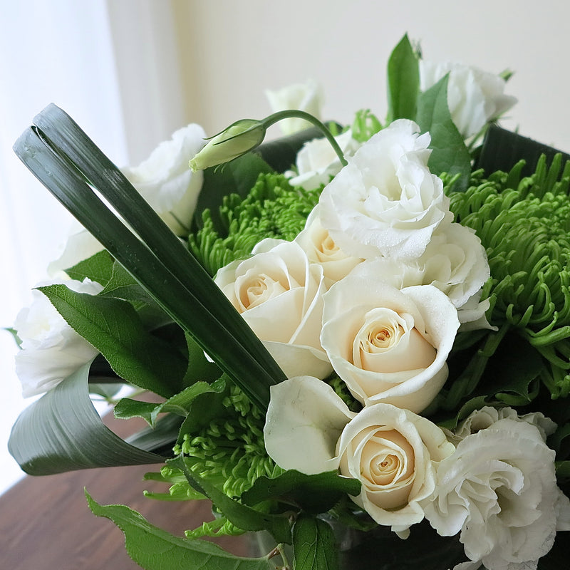 Flowers used: cream roses, white lisianthus, green chrysanthemums