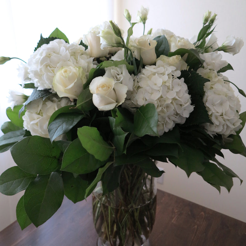 Flowers used: white roses, white hydrangeas, white lisianthus
