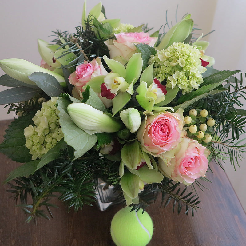 Flowers used: chartreuse cymbidium orchids, white amaryllis, pink roses, green hydrangeas, white hypericum berries