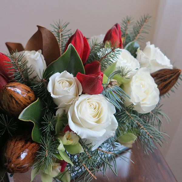 Flowers uses: white roses, red amaryllis, chartreuse cymbidium orchid