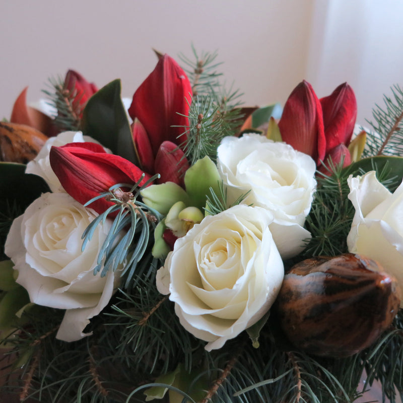 Flowers uses: white roses, red amaryllis, chartreuse cymbidium orchid