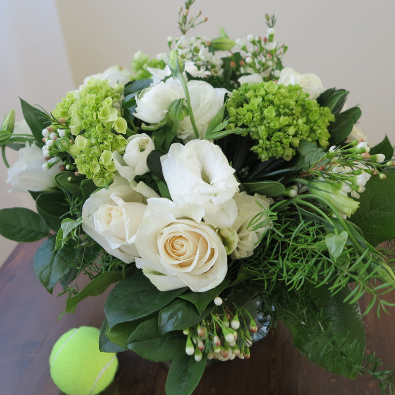 Flowers used: cream roses, white ranunculus and lisianthus green hydrangeas