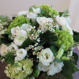Flowers used: cream roses, white ranunculus and lisianthus green hydrangeas