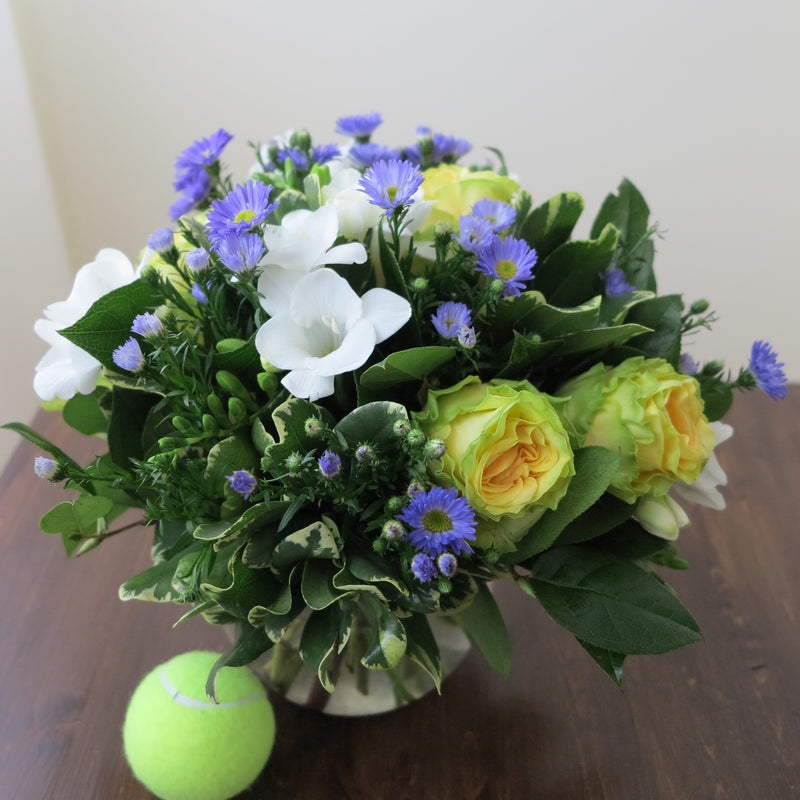Flowers used: yellow/chartreuse roses, blue asters, white freesias