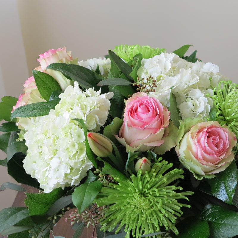 Flowers used: pink blush roses, green chrysanthemums, red tulips, white hydrangeas, seeded eucalyptus