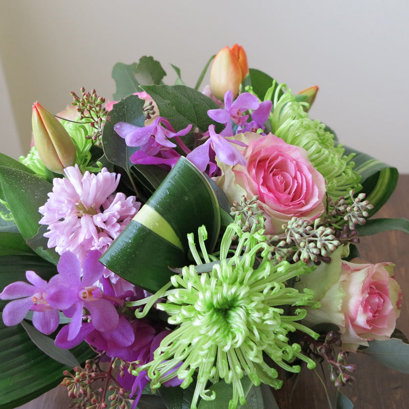 Flowers used: pink blush roses, green chrysanthemums, mauve hyacinths and orchids, red tulips, seeded eucalyptus