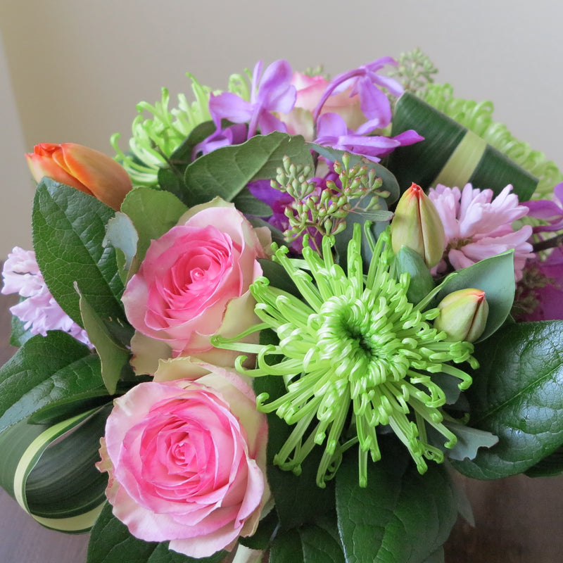 Flowers used: pink blush roses, green chrysanthemums, mauve hyacinths and orchids, red tulips, seeded eucalyptus