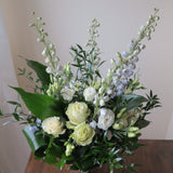 Flowers used: green roses, white lisianthus, blue delphiniums