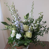 Flowers used: green roses, white lisianthus, blue delphiniums