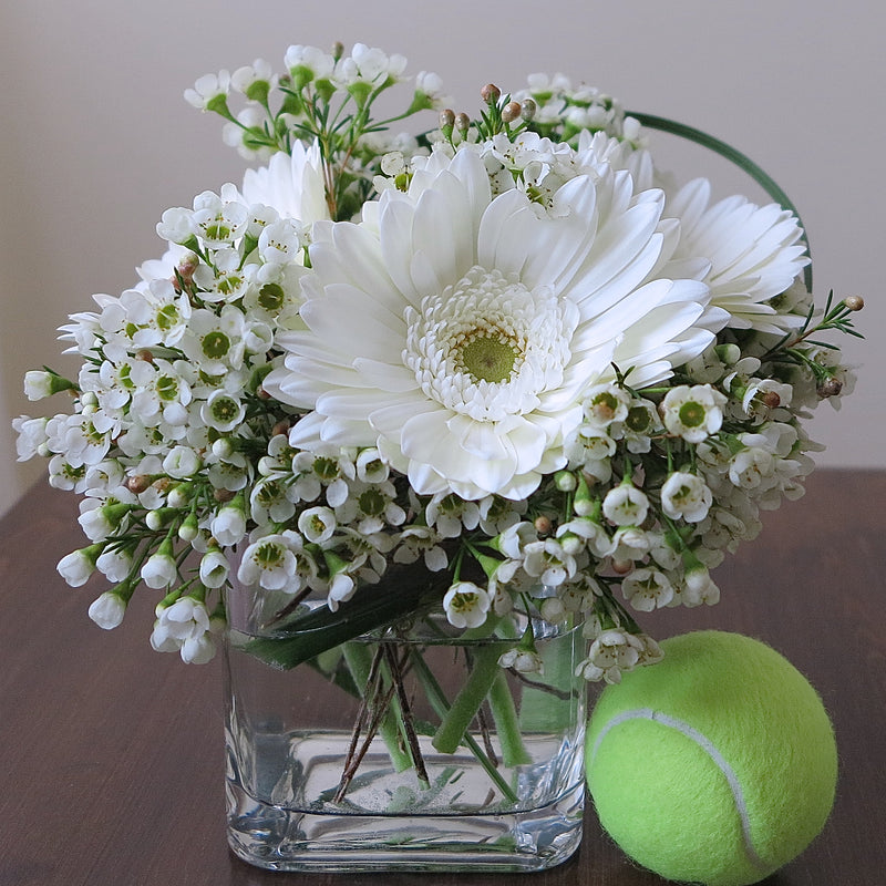 Flowers used: white gerberas, white wax flowers