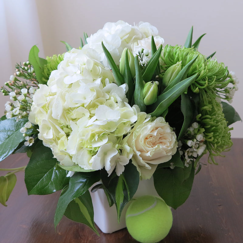 Flowers used: white roses, green chrysanthemums, white tulips, white wax flowers