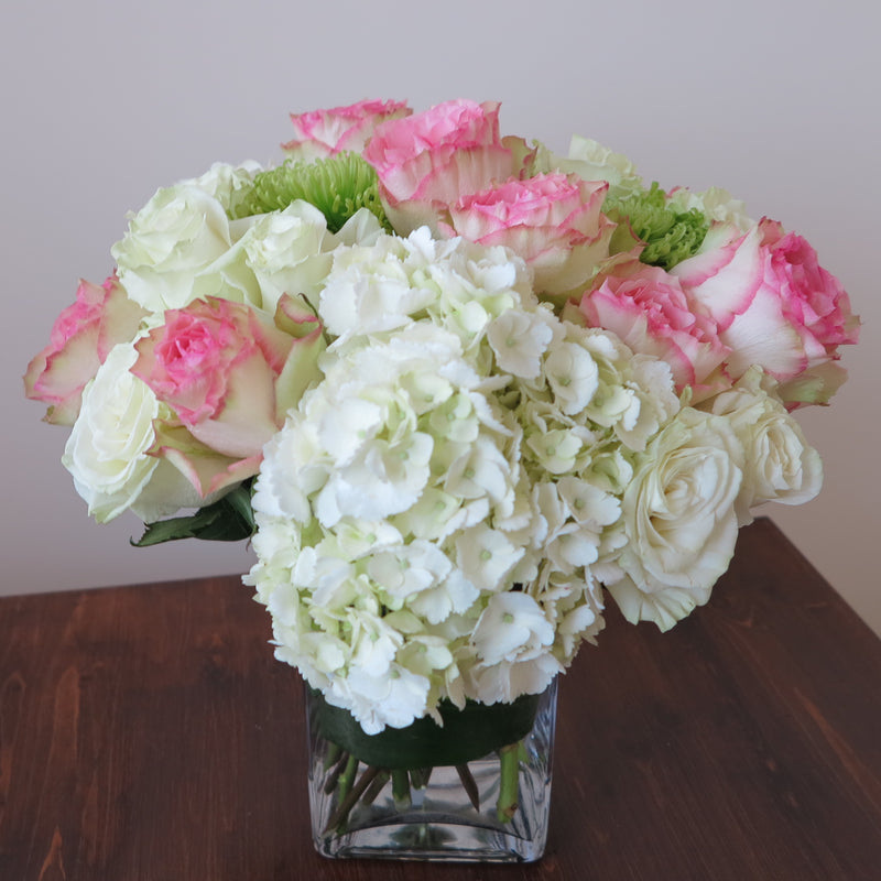 Flowers used: pink blush and white roses, green chrysanthemums, white hydrangeas