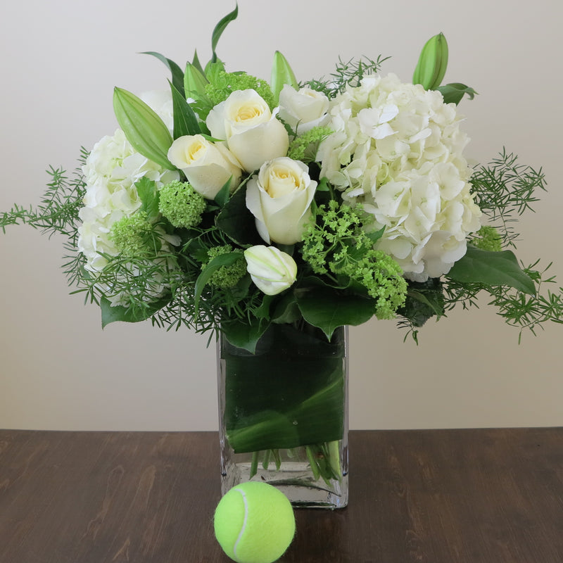 Flowers used: white roses, white hydrangeas, white lilies, green viburnum