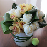 Flowers used: cream white roses, yellow cymbidium orchids