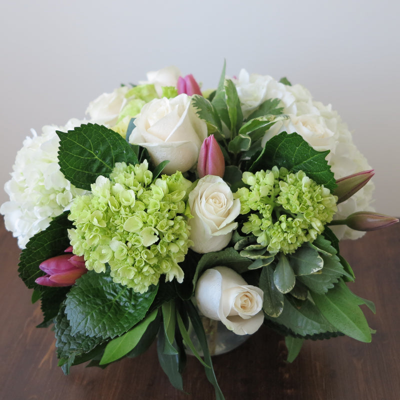 Flowers used: cream roses, white and green hydrangeas, pink tulips, chartreuse lisianthus
