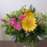 Flowers used: pink roses, yellow gerberas, pink tulips, rustic green hydrangeas, chartreuse lady's mantle
