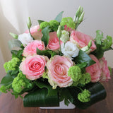 Flowers used: pink roses, green viburnums, white lisianthus