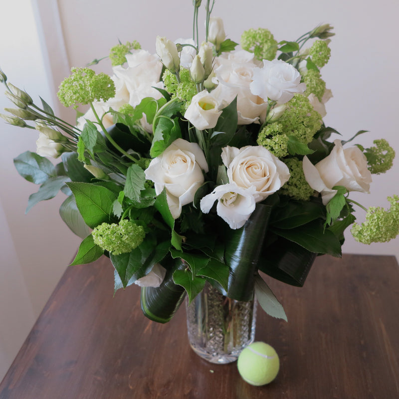 Flowers used: white roses, white lisianthus and green viburnum