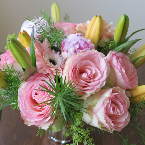 Flowers used: orange lilies, salmon pink roses and gerberas, pink peonies