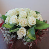 Flowers used: cream roses, hosta leaves