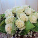 Flowers used: cream roses, hosta leaves