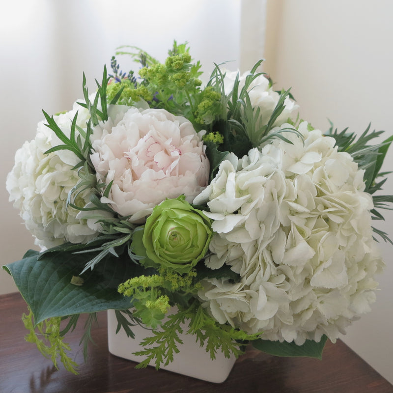 Flowers used: green roses, white hydrangeas, chartreuse lady's mantle, blush white peonies