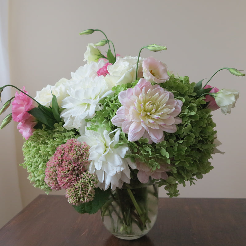 Flowers used: green hydrangeas, cream roses, white and blush pink dahlias, white and pink lisianthus, pink sedums