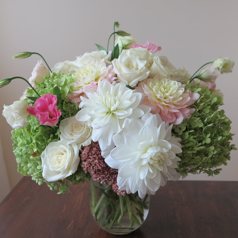 Flowers used: green hydrangeas, cream roses, white and blush pink dahlias, white and pink lisianthus, pink sedums