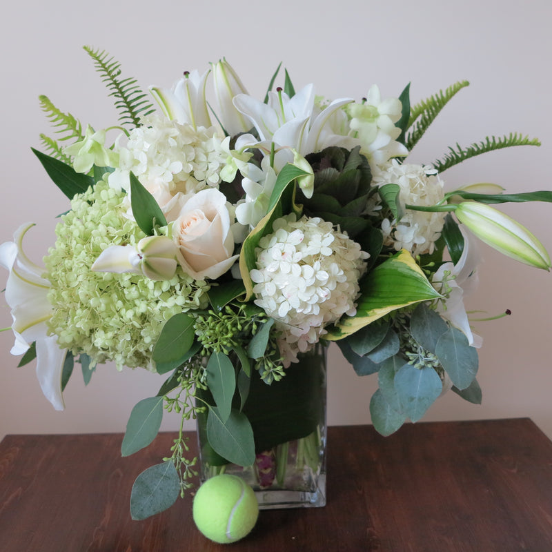 Flowers used: cream roses, white and green hydrangeas, white orchids, white lilies, green kales
