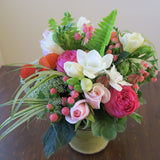 Flowers used: pink roses, orange ranunculus, white freesias, white Anne's Lace, pink hypericum berries