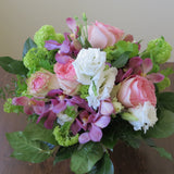 Flowers used: pink roses, mauve orchids, white lisianthus and green viburnum