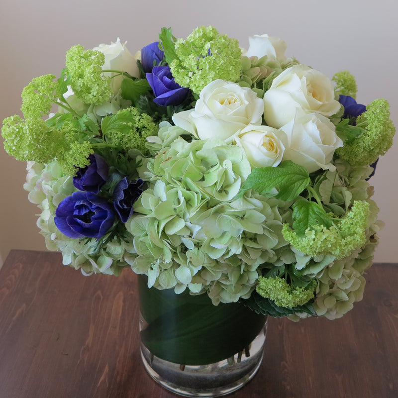 Flowers used: cream white roses, blue anemones, green hydrangeas, green viburnum, white lisianthus